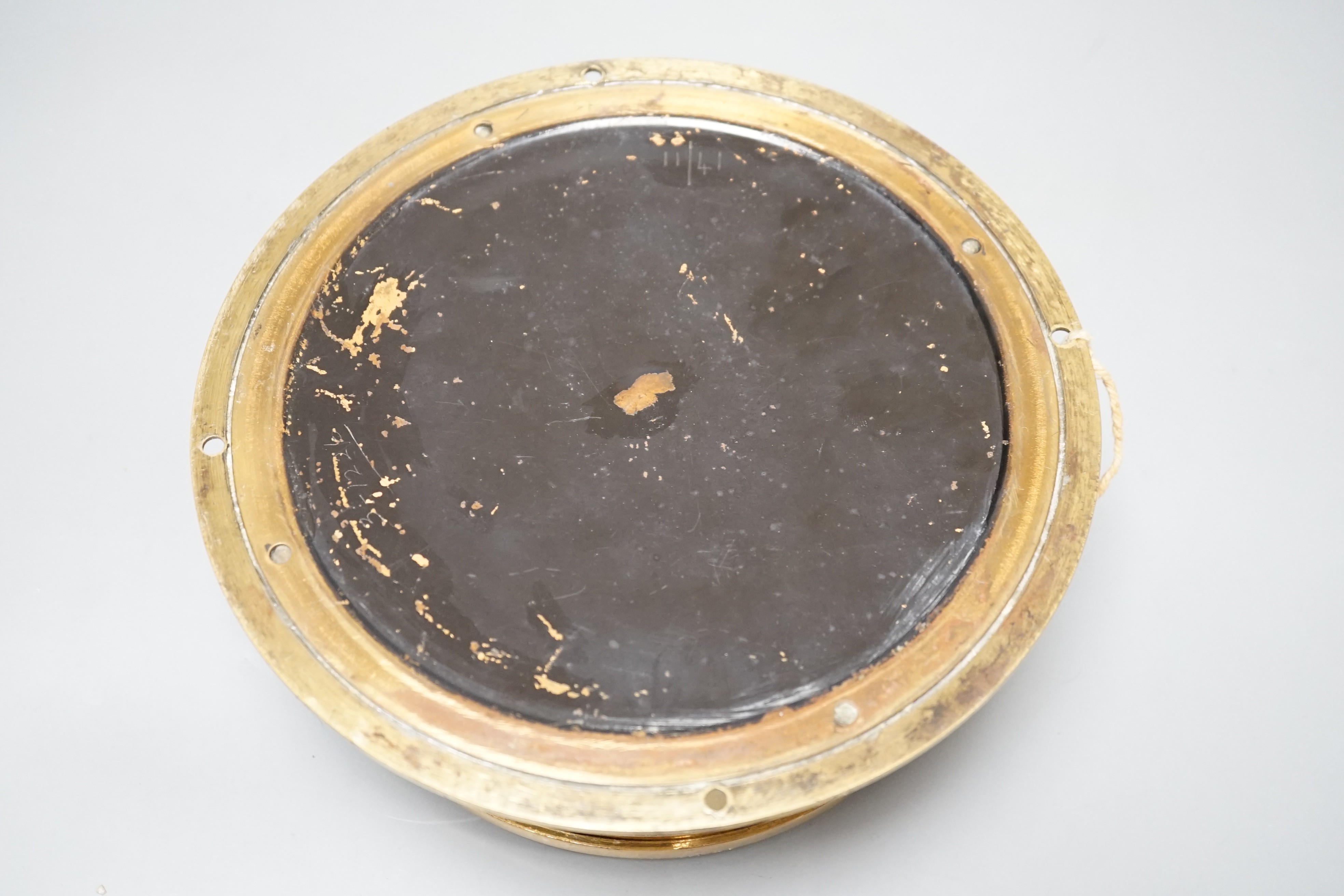 An early 20th century brass ships bulkhead timepiece with key